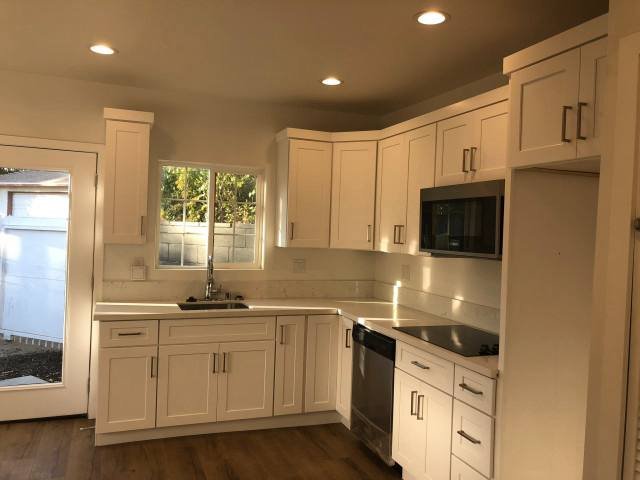 Finished white shaker kitchen cabinets with stainless appliances, Sapphire Remodeling project